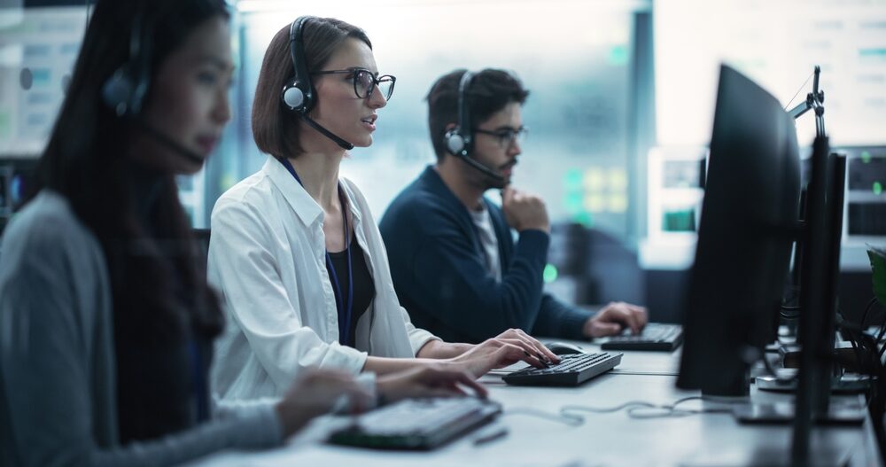Helpdesk employees is busy on taking calls